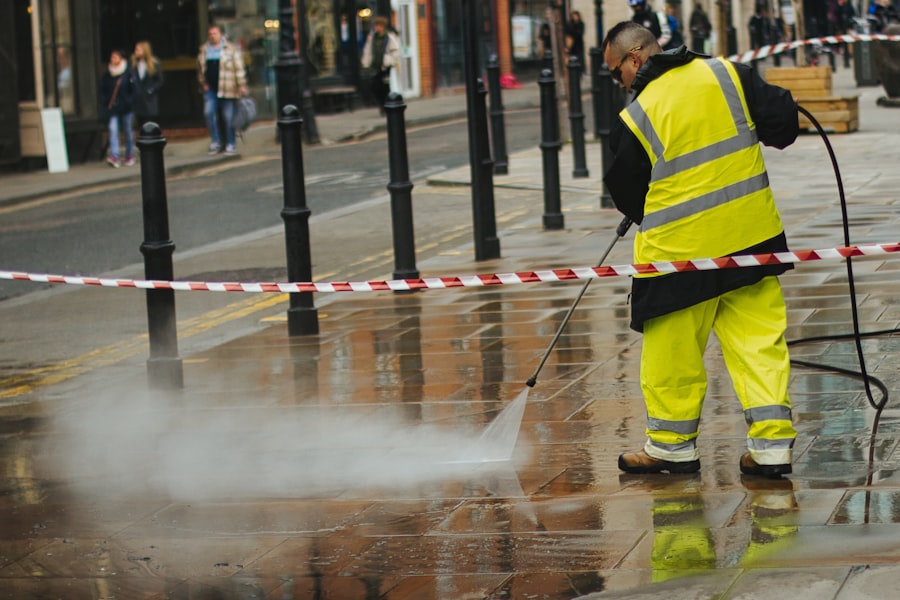 Pressure washing a paved walkway